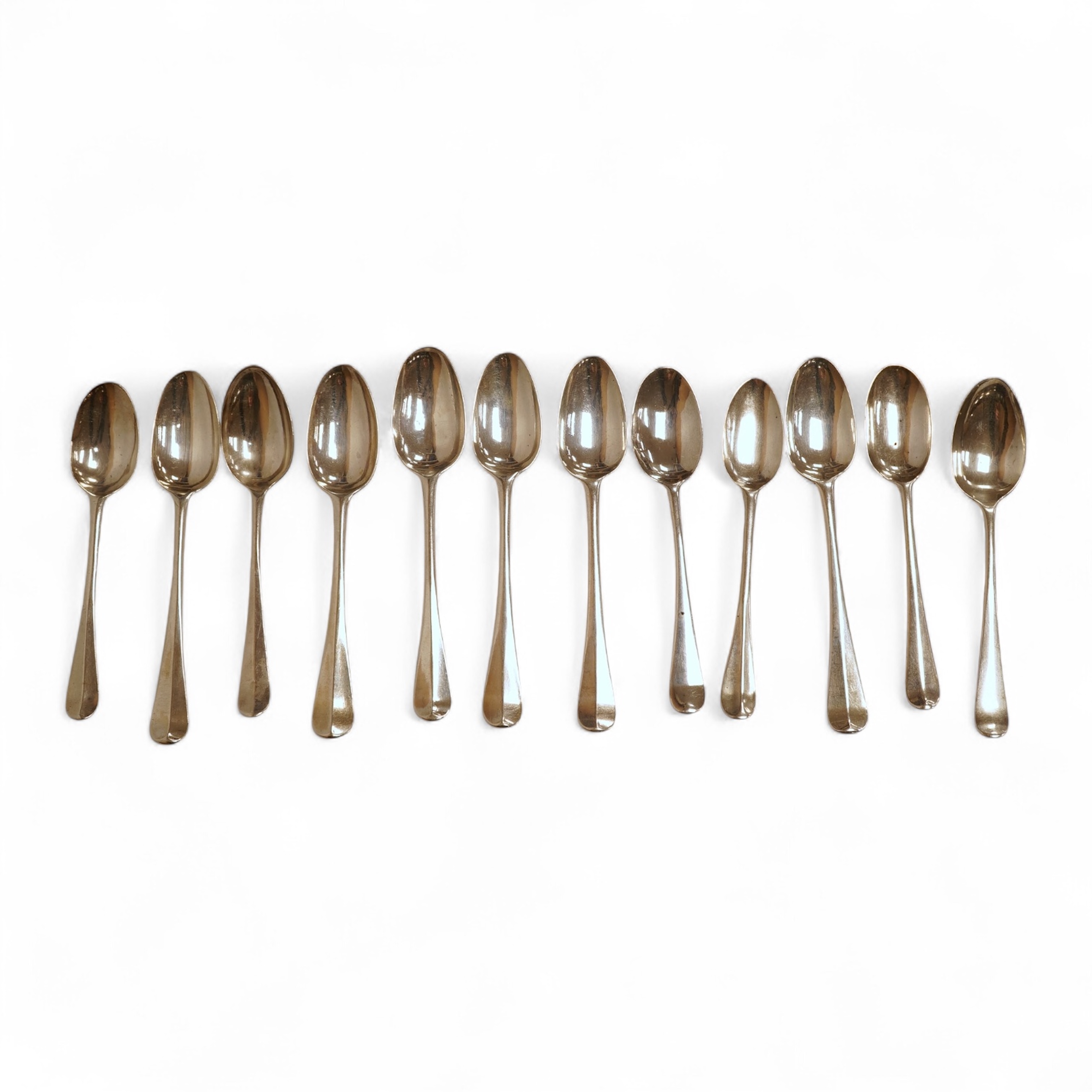 A group of twelve assorted Georgian silver base mark rat tail teaspoons, various dates and makers, indistinct marks, 4.4oz.